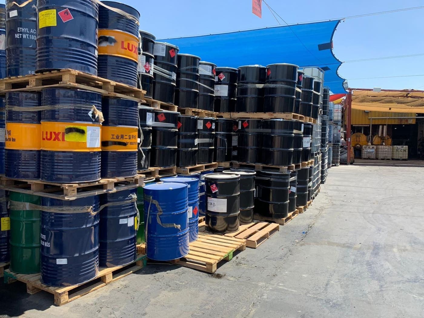 Drums of solvent on pallets at the Mata yard